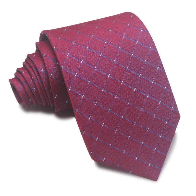 Close-up of a red and black striped jacquard weave tie with an arrow tip, showing texture.