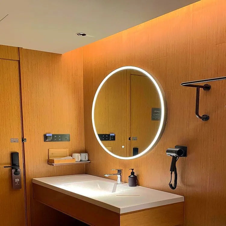 Round wall-mounted smart bathroom mirror with black aluminium alloy frame and touch-controlled LED lighting