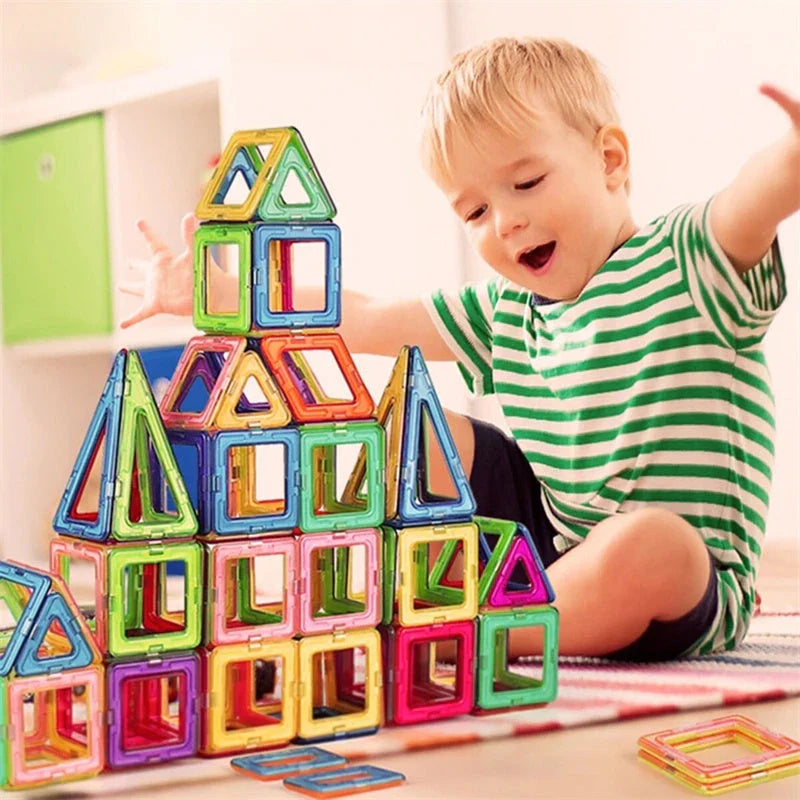 Colorful magnetic building blocks with children playing and building structures
