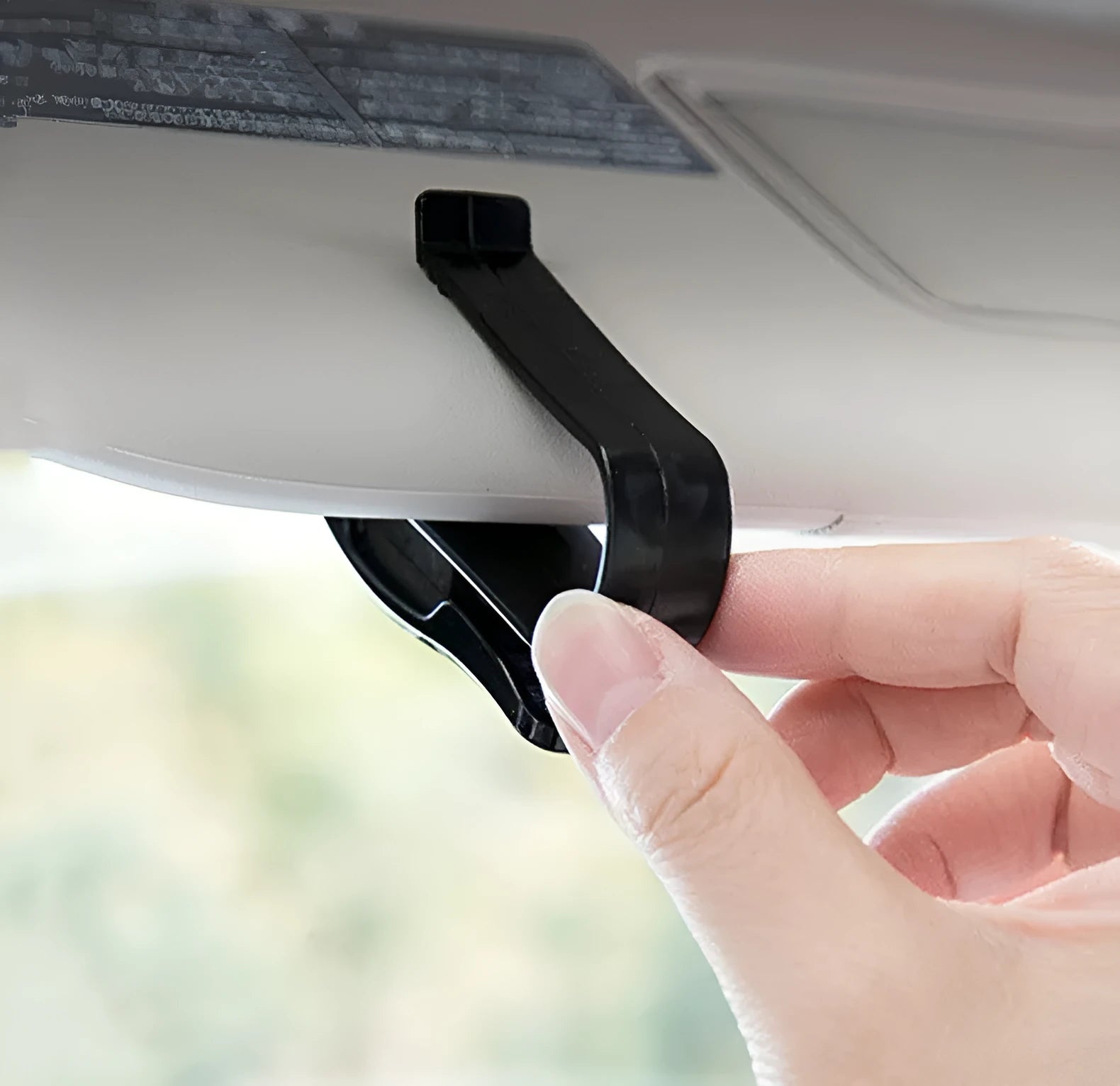 Black plastic car sun visor clip for glasses, tickets, and ID cards measuring 6.5cm long