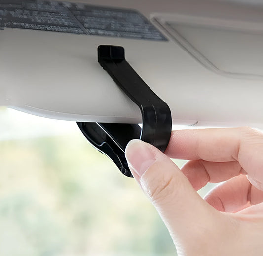 Black plastic car sun visor clip for glasses, tickets, and ID cards measuring 6.5cm long