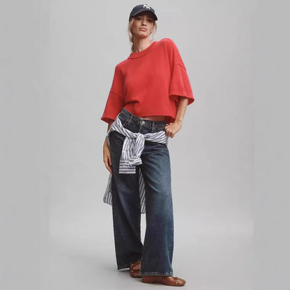 Red short viscose T-shirt with an exposed navel design on a mannequin.
