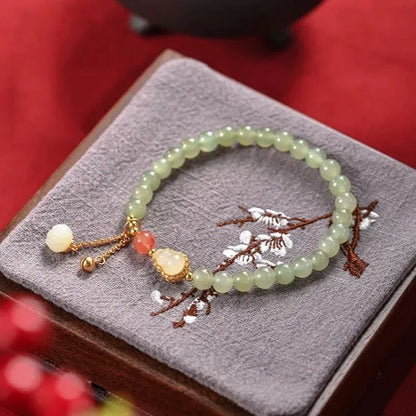 Qingshui jade women's bracelet with gold gourd charm and fu character on 6mm beads