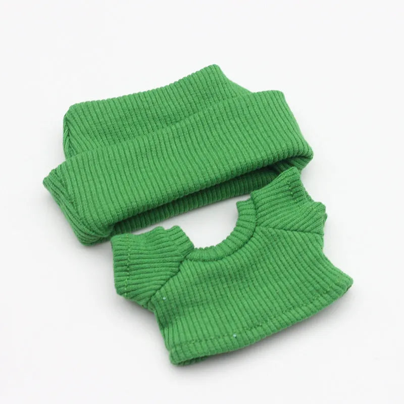 Doll clothes set with knitted flanging hat and T-shirt in multiple colours including pink, white, and stripes.