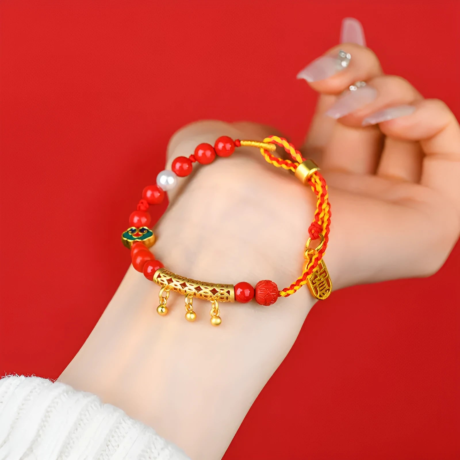 Women's red cinnabar hand-woven rope bracelet with geometric design and bell charm
