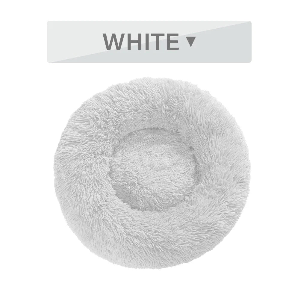 Fluffy donut-shaped dog bed in dark grey colour with raised edges, showing plush texture and circular design