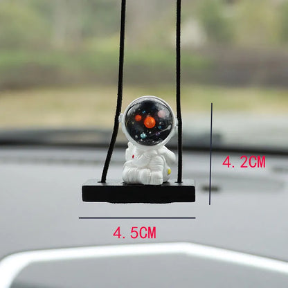 Colourful resin astronaut car pendant ornament with cartoon spaceman design on car dashboard