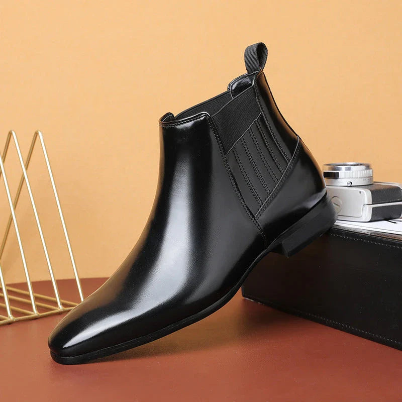 Sleek Chelsea-style boots for men with pointed toe and square heel, available in black and brown colors