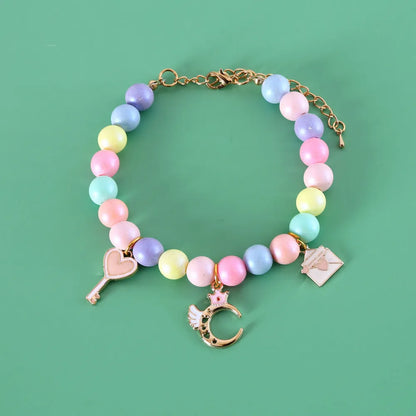Adjustable resin pet collar with macaron designs in six colours, showing sizing from 15-38cm