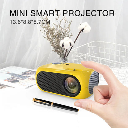 M24 gold and white portable mini LED projector with remote on a wooden table.
