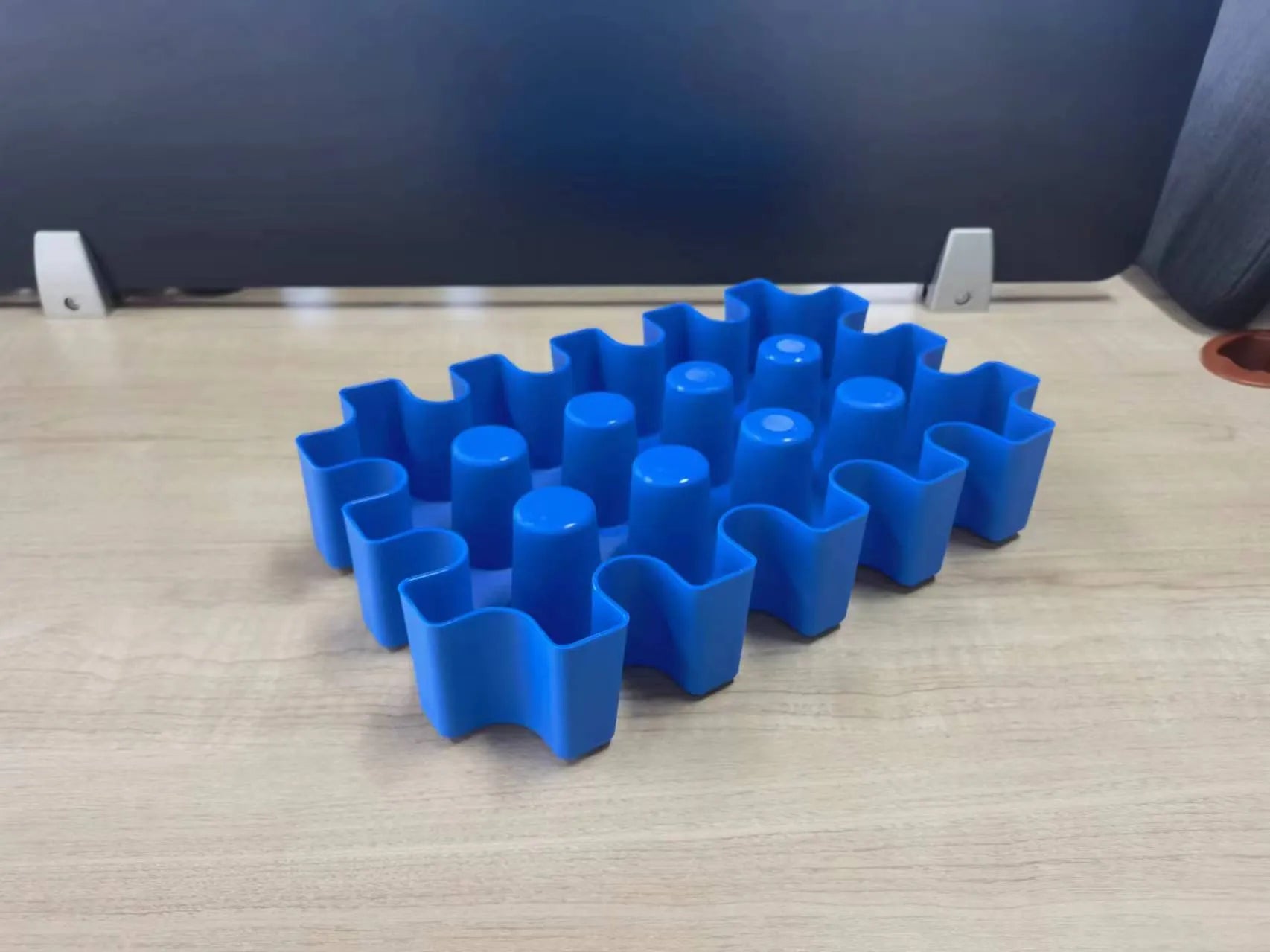 Blue plastic outdoor ice maker tray measuring 34cm long by 22cm wide