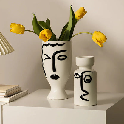 Ceramic vase with hand-painted surface in modern minimalist design, shown in large and small size variations
