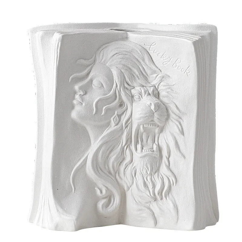 White ceramic book stand holding an open book at an angle, with a wire page holder in use.