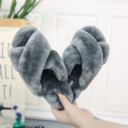 Cross open-toe fur slippers with non-slip patterned soles in black, showing ergonomic heel design