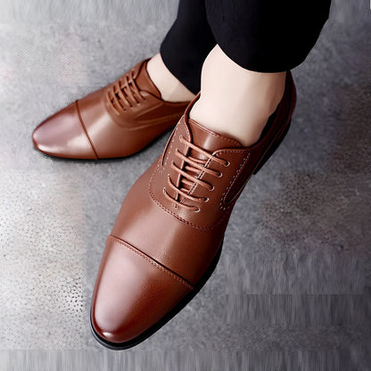 Men's black and brown casual leather shoes with sewing line detailing and rubber soles