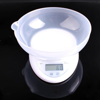 White electronic kitchen scale with digital display showing 1g precision and 5kg capacity measurements