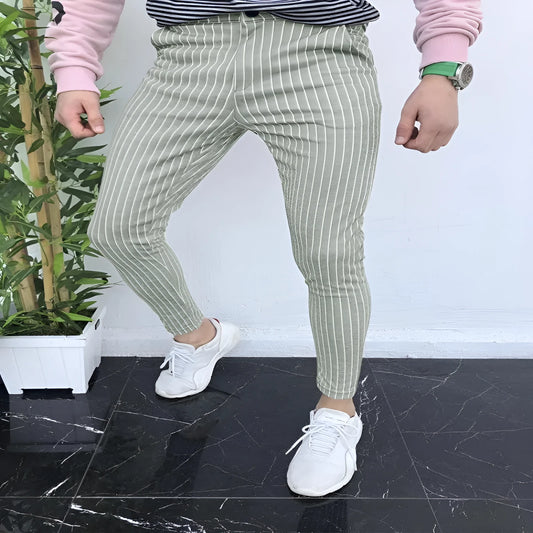 Man wearing slim-fit straight-leg plaid trousers with a 3D printed pattern and a casual shirt.
