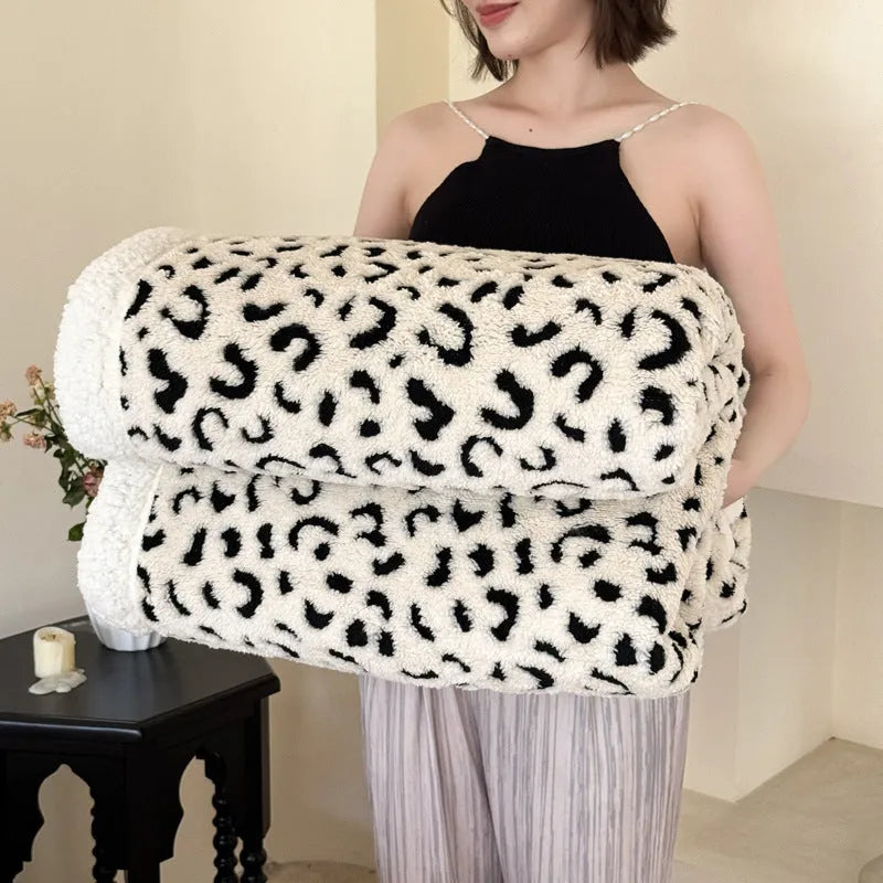 Double-layer cationic leopard jacquard taffeta blanket showing raised animal print pattern in available colour options