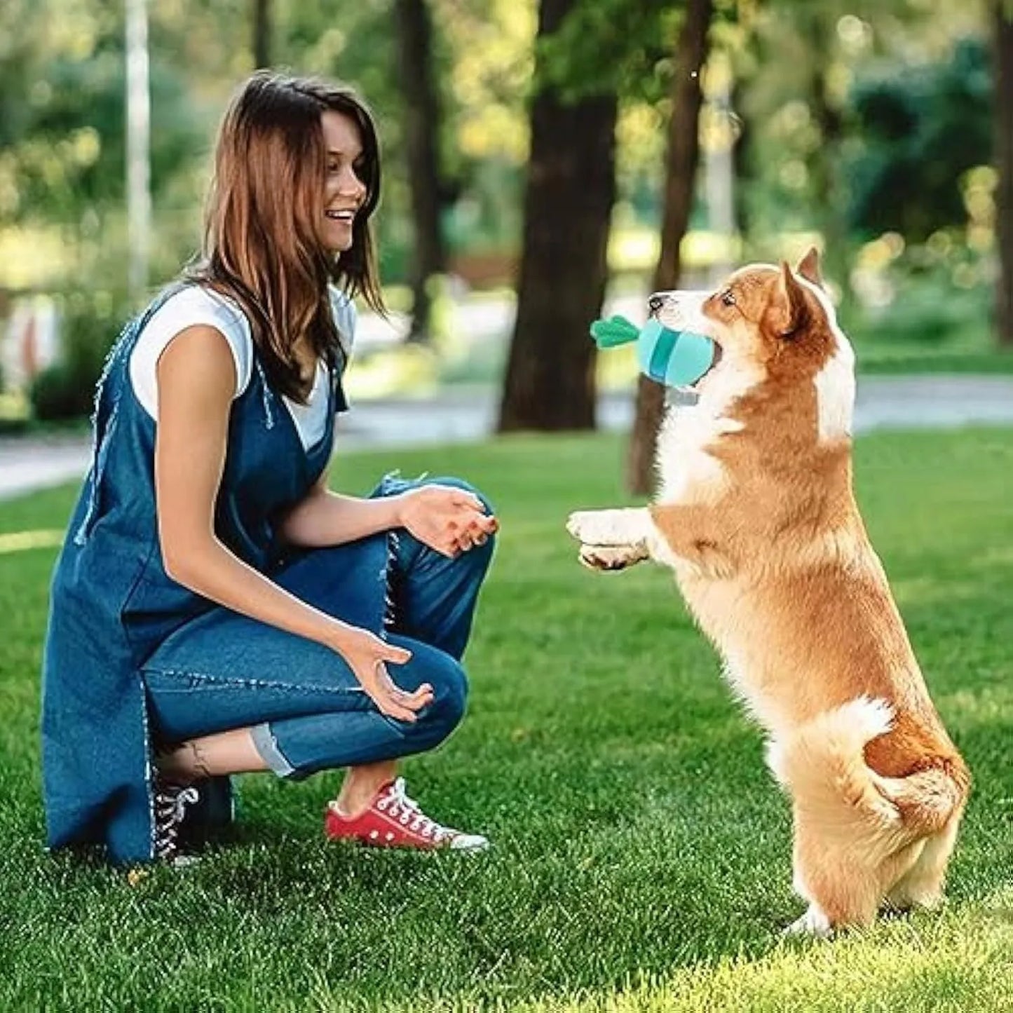 Blue interactive dog toy with tumbler design and treat dispensing holes, measuring 8.8cm for medium to large dogs