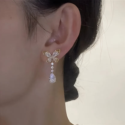 Bow stud earrings with platinum electroplated finish on zinc alloy