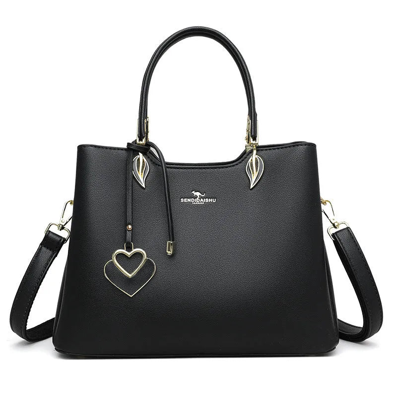 Women's black PU leather messenger bag with multi-layer shoulder strap and sewing thread detailing.