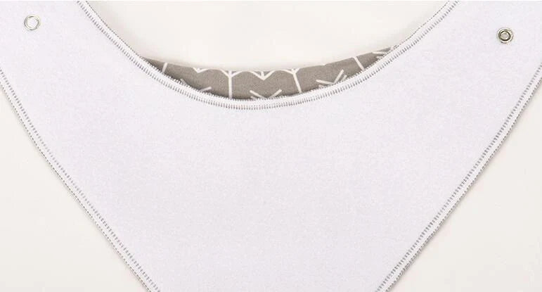 Stylish baby bibs and burp cloths featuring trendy arrow, wave, and triangle designs in soft, absorbent cotton