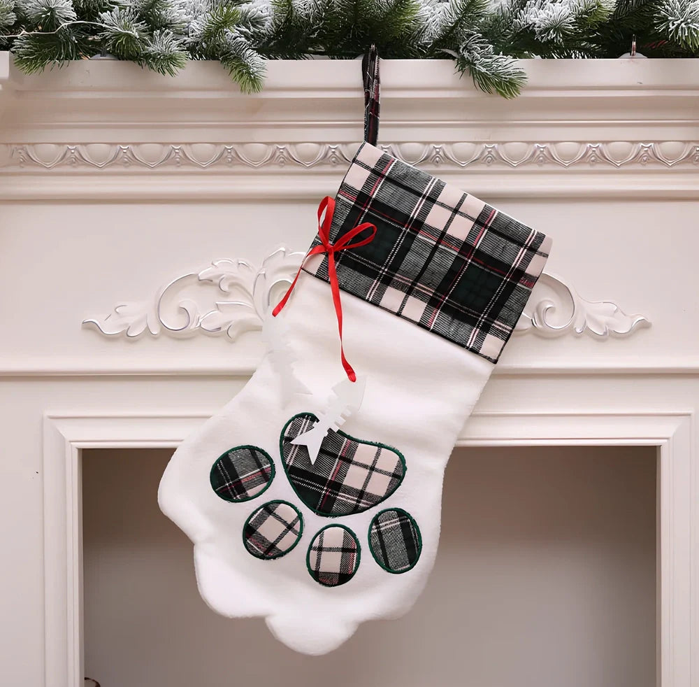 Red dog paw shaped Christmas stocking measuring 20cm by 46cm with reinforced hanging loop