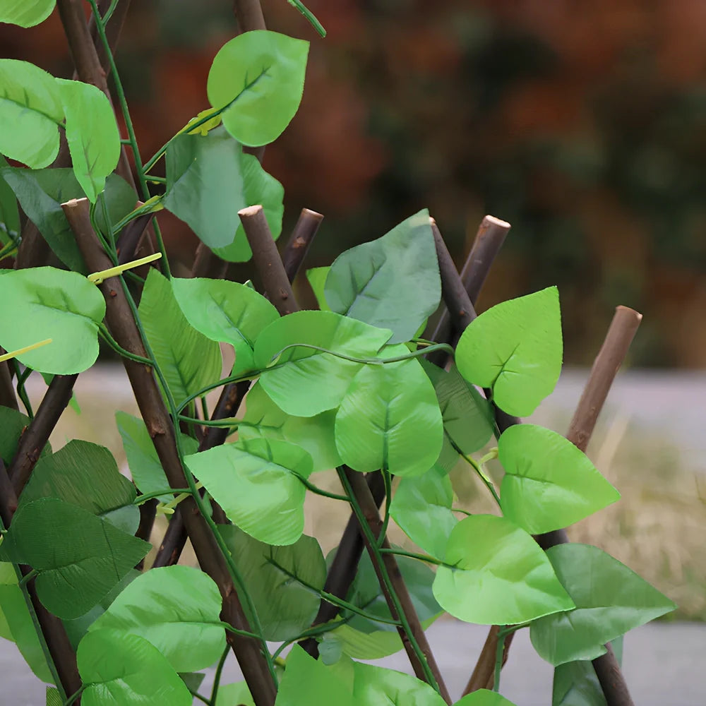 Plastic simulation wooden fence panel showing realistic wood grain texture in outdoor setting