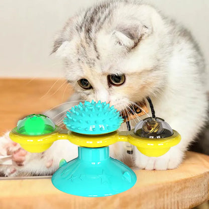 Cat rotating windmill toy with suction base, two transparent bins, blue and yellow-green TPR body.