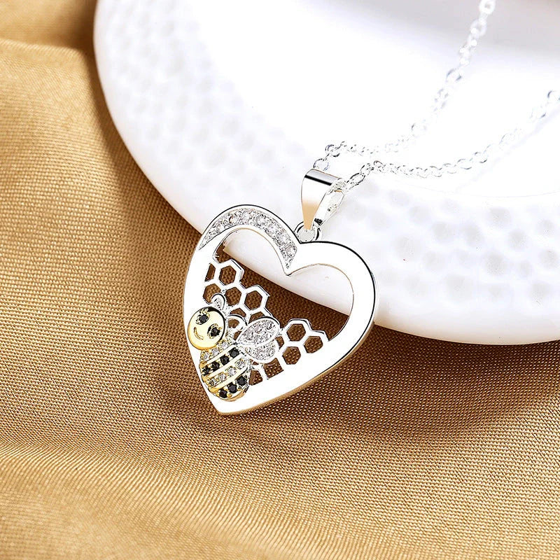 Pastoral-style bee hive pendant necklace with hearts color separation, made of copper