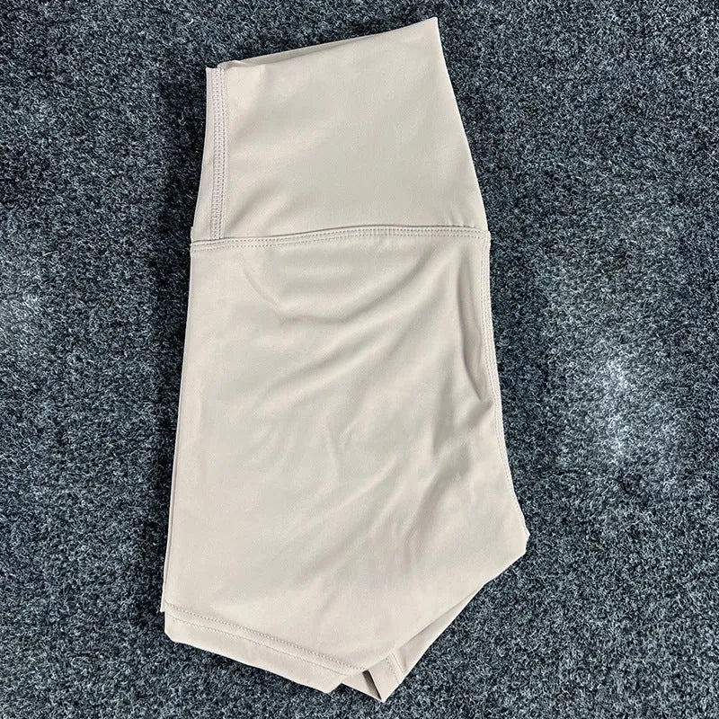 High-waisted yoga shorts in nylon fabric for moisture-wicking during sports, available in multiple colours and sizes.