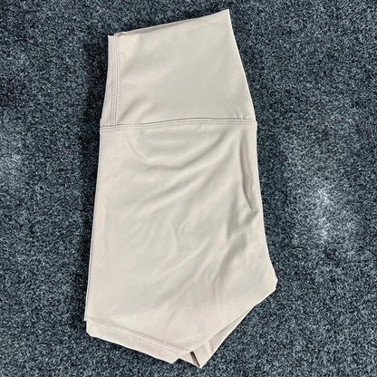High-waisted yoga shorts in nylon fabric for moisture-wicking during sports, available in multiple colours and sizes.
