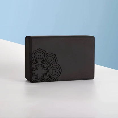 Black mandala pattern yoga brick measuring 23cm with textured surface for enhanced grip during yoga practice