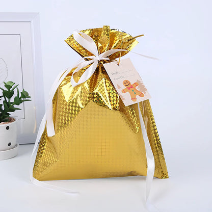 Christmas gift bag with drawstring closure in laser gold finish, 32x24cm dimensions