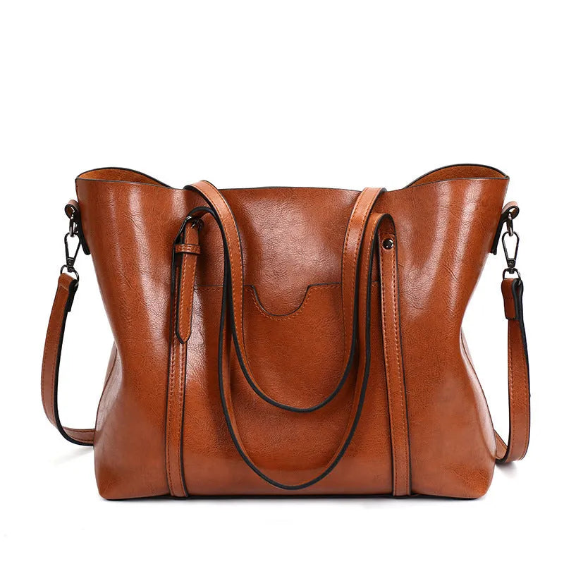 Retro messenger bag showing 31cm length, A4 magazine capacity, available in eight colours including wine red and light blue