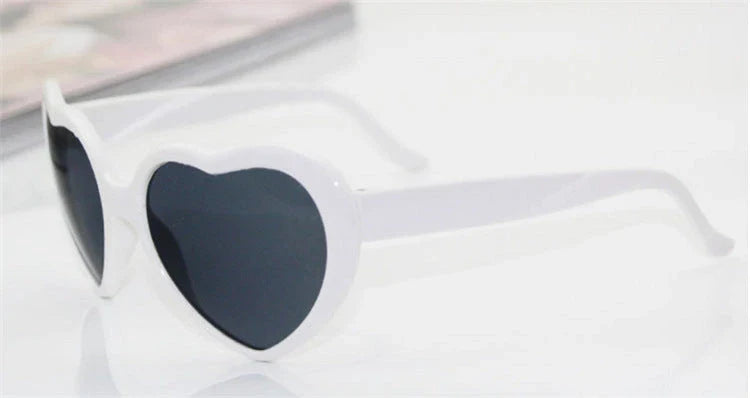 Stylish heart-shaped lighting sunglasses with a plastic frame and resin lenses, creating a mesmerizing effect for romantic occasions