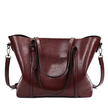 Retro messenger bag showing 31cm length, A4 magazine capacity, available in eight colours including wine red and light blue
