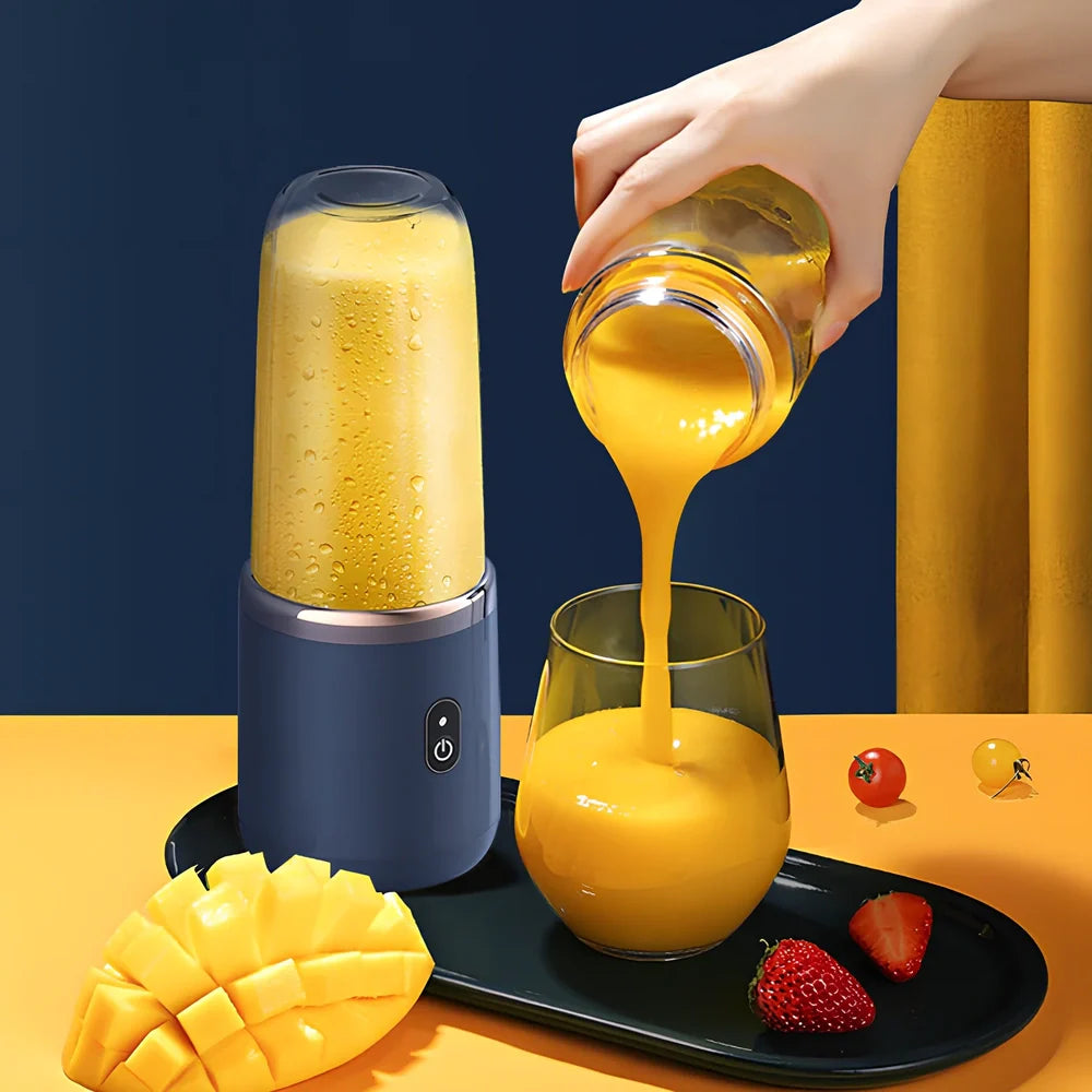 Portable juicer cup in sapphire blue with 400ml capacity and USB charging cable