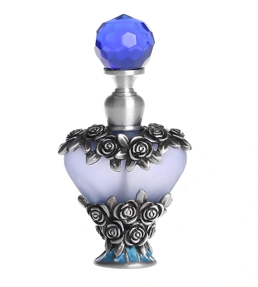 Heart-shaped refillable perfume bottle with metal and crystal construction, 3.6 inches tall