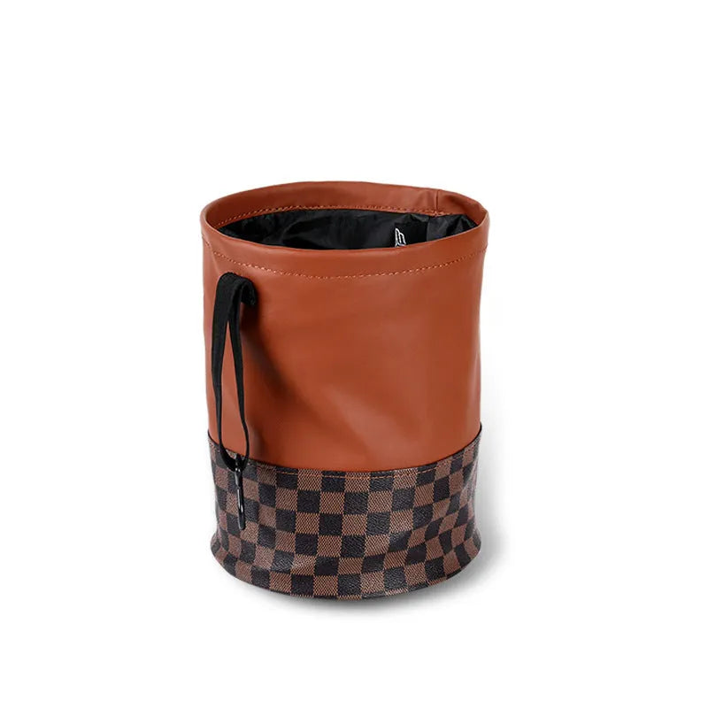 Black leather foldable car rubbish bin with a handle, shown empty.