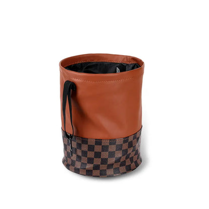 Black leather foldable car rubbish bin with a handle, shown empty.