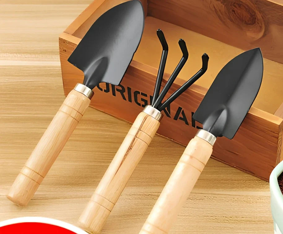 Three-piece gardening tool set showing trowel, hand fork, and weeder with carbon steel blades