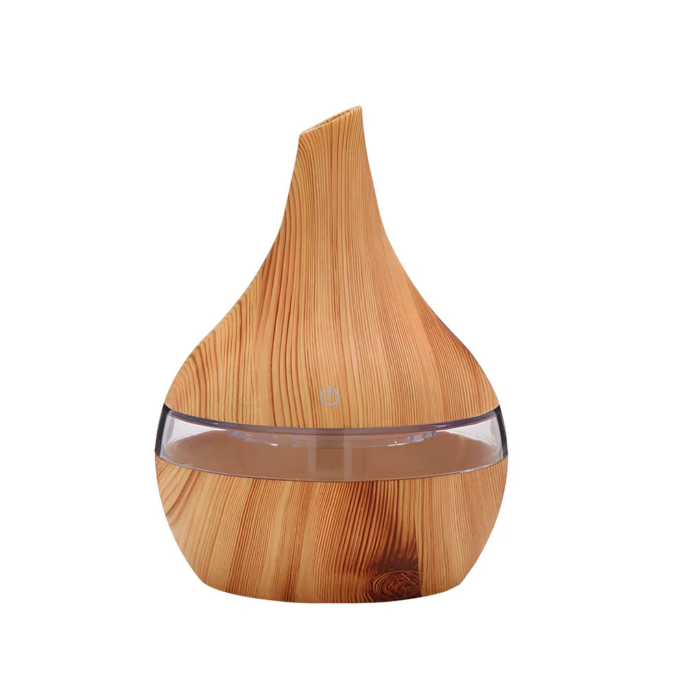 Round wood grain humidifier with USB cable on wooden surface