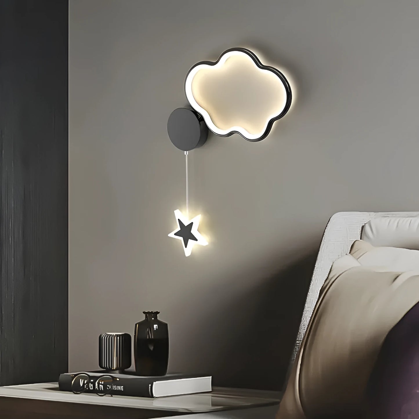 Black five-pointed star shaped children's wall lamp with a left-facing cloud design and touch control for three colour LED light.