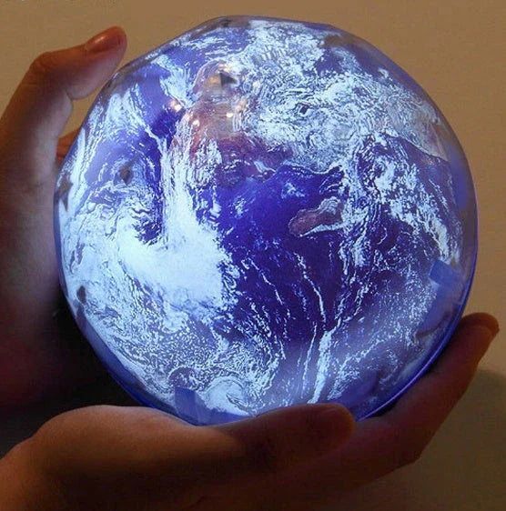 Galaxy Projector Lamp with various celestial projection effects, including moon, constellation, and earth patterns