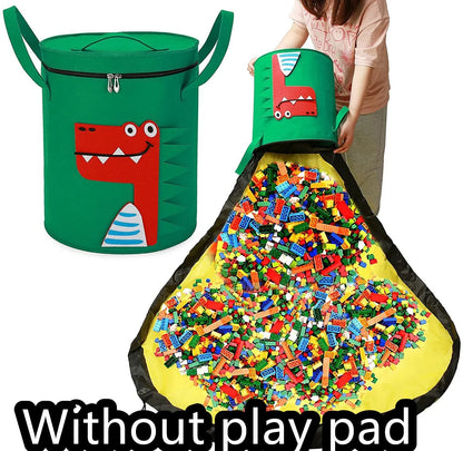 Green felt storage cube with pull rope unfolded into a large square play mat on a wooden floor.