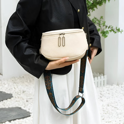 Women's soft PU leather messenger bag in saddle shape with crossbody strap and zip compartment