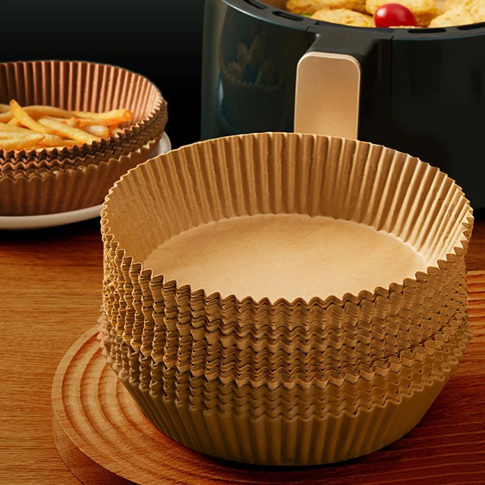 Disposable air fryer liners made of durable, food-grade parchment paper for effortless cleanup and healthy cooking