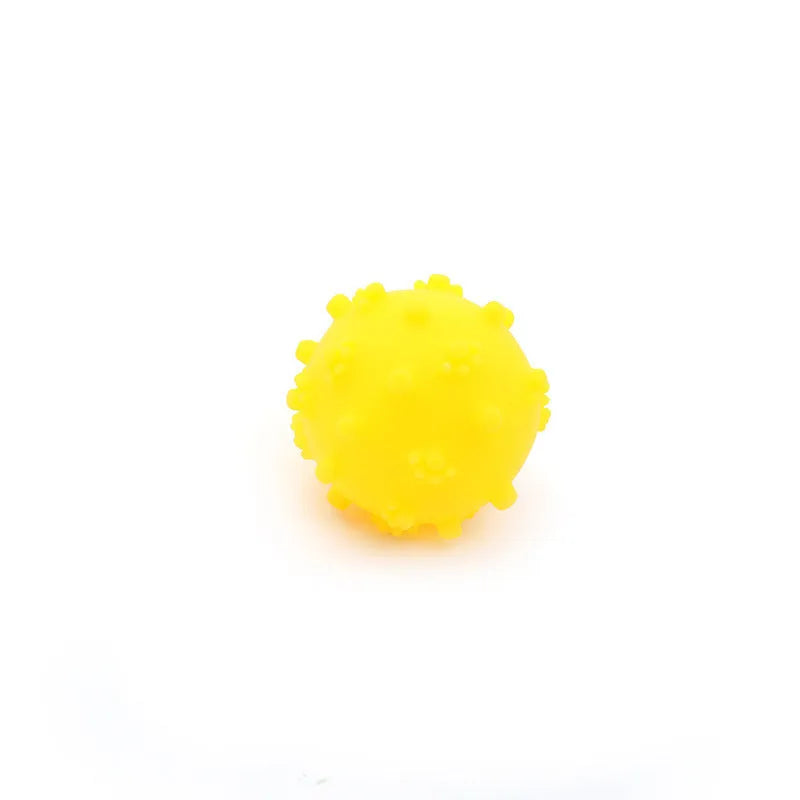 Four colourful spiky dog balls with paw print dimples, measuring 2 inches diameter for small breed dogs