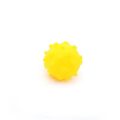 Four colourful spiky dog balls with paw print dimples, measuring 2 inches diameter for small breed dogs